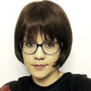 Trish Lee Woman with a short, dark bob and dark-rimmed glasses